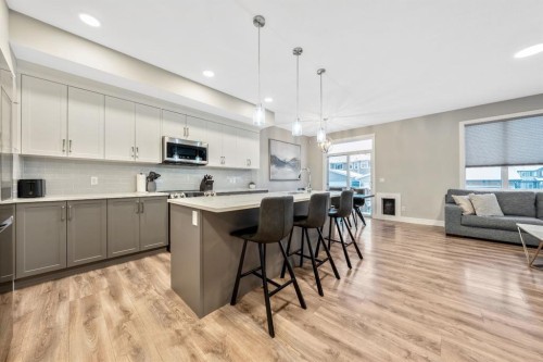 135 Belgian Crescent, Cochrane, AB - Indoor Photo Showing Kitchen With Upgraded Kitchen
