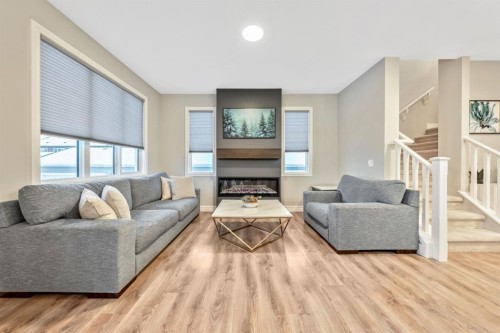 135 Belgian Crescent, Cochrane, AB - Indoor Photo Showing Living Room With Fireplace