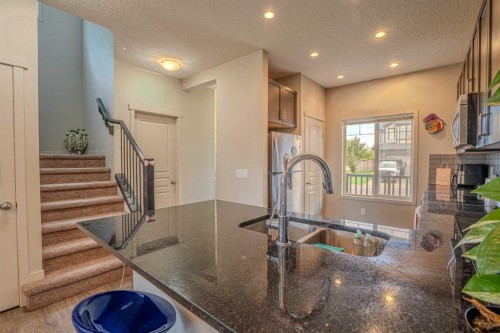4 Copperpond Parade Se, Calgary, AB - Indoor Photo Showing Kitchen With Double Sink With Upgraded Kitchen