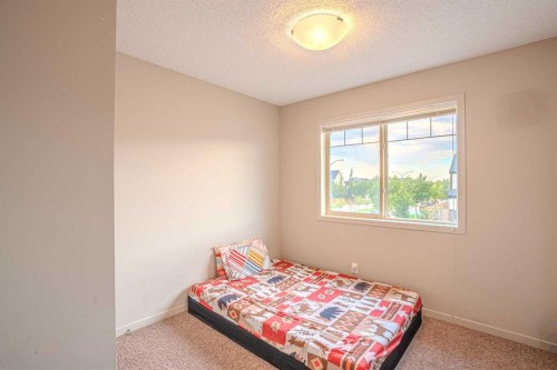 4 Copperpond Parade Se, Calgary, AB - Indoor Photo Showing Bedroom