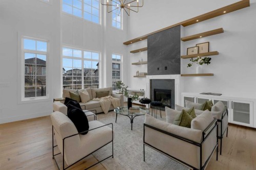 1432 Coopers Landing Sw, Airdrie, AB - Indoor Photo Showing Living Room With Fireplace