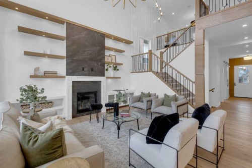 1432 Coopers Landing Sw, Airdrie, AB - Indoor Photo Showing Living Room With Fireplace