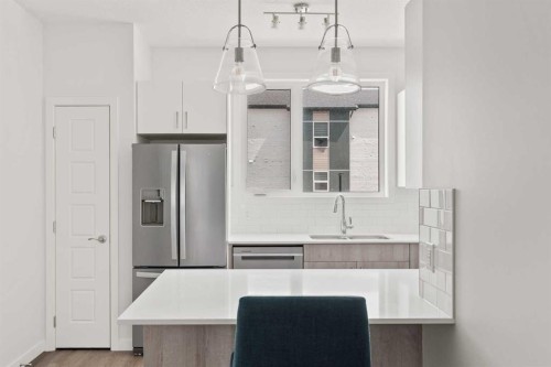 405-301 Redstone Boulevard Ne, Calgary, AB - Indoor Photo Showing Kitchen With Upgraded Kitchen