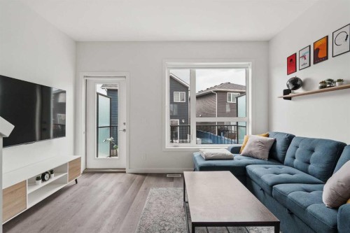 405-301 Redstone Boulevard Ne, Calgary, AB - Indoor Photo Showing Living Room