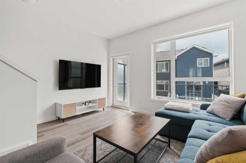 405-301 Redstone Boulevard Ne, Calgary, AB - Indoor Photo Showing Living Room