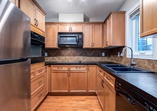 12 Royal Oak Lane Nw, Calgary, AB - Indoor Photo Showing Kitchen With Double Sink