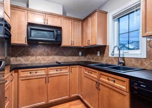 12 Royal Oak Lane Nw, Calgary, AB - Indoor Photo Showing Kitchen With Double Sink