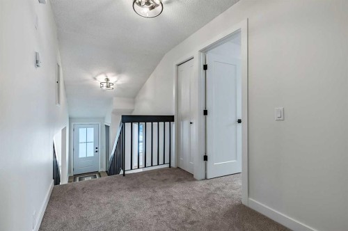 15 Woodford Crescent Sw, Calgary, AB - Indoor Photo Showing Other Room