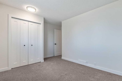 15 Woodford Crescent Sw, Calgary, AB - Indoor Photo Showing Other Room