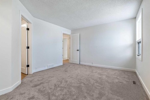15 Woodford Crescent Sw, Calgary, AB - Indoor Photo Showing Other Room