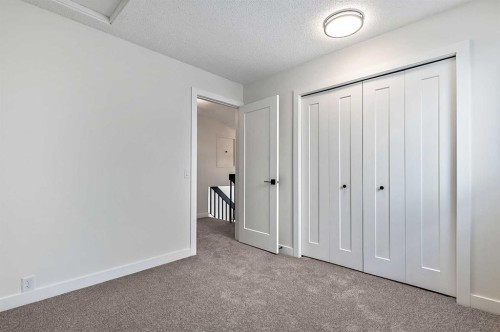 15 Woodford Crescent Sw, Calgary, AB - Indoor Photo Showing Other Room