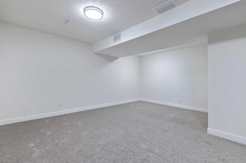 15 Woodford Crescent Sw, Calgary, AB - Indoor Photo Showing Other Room