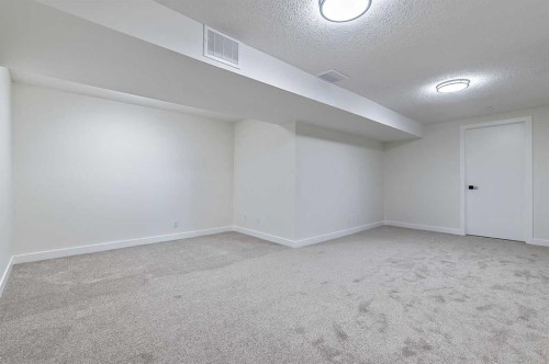 15 Woodford Crescent Sw, Calgary, AB - Indoor Photo Showing Other Room
