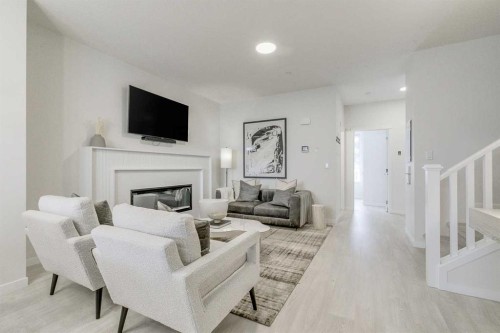 80 Lucas Common Nw, Calgary, AB - Indoor Photo Showing Living Room With Fireplace