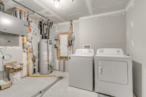 80 Lucas Common Nw, Calgary, AB - Indoor Photo Showing Laundry Room