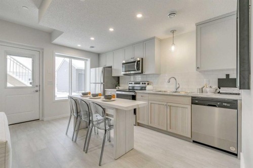 80 Lucas Common Nw, Calgary, AB - Indoor Photo Showing Kitchen With Upgraded Kitchen