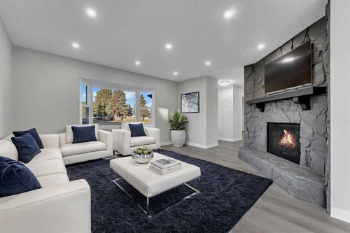 4515 Fordham Crescent Se, Calgary, AB - Indoor Photo Showing Living Room With Fireplace