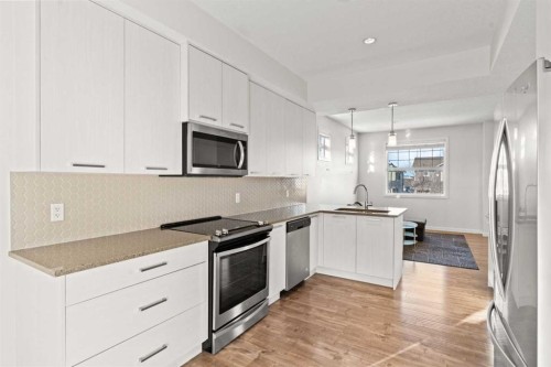 901-115 Sagewood Drive Sw, Airdrie, AB - Indoor Photo Showing Kitchen With Stainless Steel Kitchen With Upgraded Kitchen