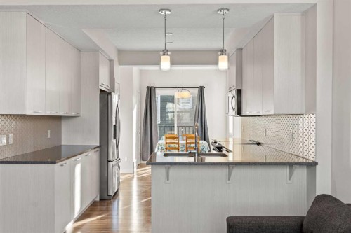 901-115 Sagewood Drive Sw, Airdrie, AB - Indoor Photo Showing Kitchen With Upgraded Kitchen