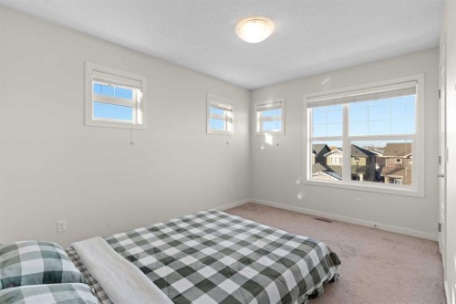901-115 Sagewood Drive Sw, Airdrie, AB - Indoor Photo Showing Bedroom