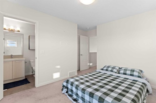 901-115 Sagewood Drive Sw, Airdrie, AB - Indoor Photo Showing Bedroom