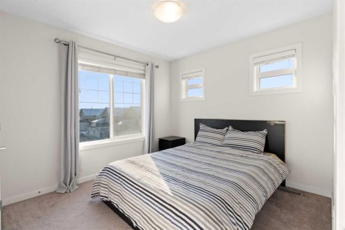 901-115 Sagewood Drive Sw, Airdrie, AB - Indoor Photo Showing Bedroom