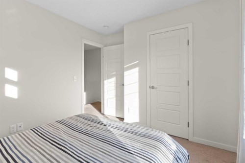 901-115 Sagewood Drive Sw, Airdrie, AB - Indoor Photo Showing Bedroom