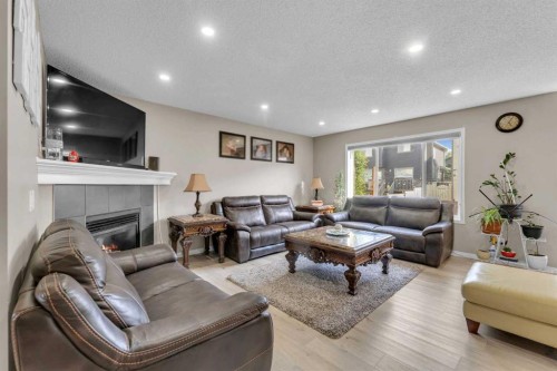 138 Saddlecrest Park Ne, Calgary, AB - Indoor Photo Showing Living Room With Fireplace
