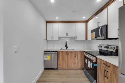 4311 7A Avenue Se, Calgary, AB - Indoor Photo Showing Kitchen With Stainless Steel Kitchen With Double Sink
