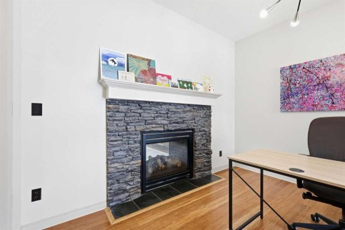 9 Sage Hill Landing Nw, Calgary, AB - Indoor Photo Showing Office With Fireplace