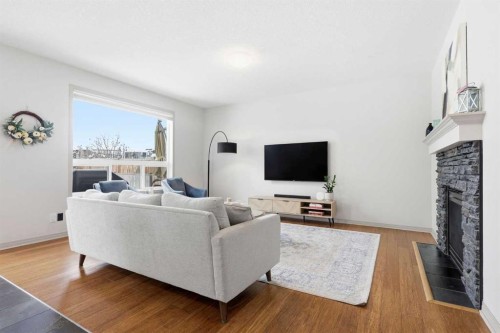 9 Sage Hill Landing Nw, Calgary, AB - Indoor Photo Showing Living Room With Fireplace