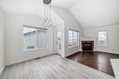 226 Saddlebrook Circle Ne, Calgary, AB - Indoor Photo Showing Living Room With Fireplace
