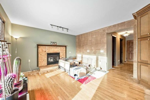 15 Strathlorne Bay Sw, Calgary, AB - Indoor With Fireplace