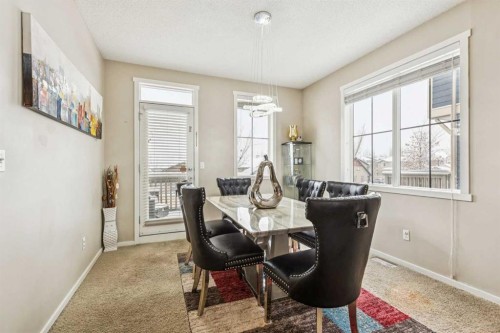 1202-125 Panatella Way Nw, Calgary, AB - Indoor Photo Showing Dining Room