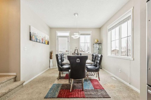 1202-125 Panatella Way Nw, Calgary, AB - Indoor Photo Showing Dining Room