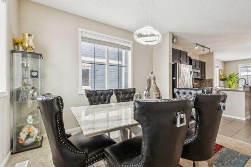 1202-125 Panatella Way Nw, Calgary, AB - Indoor Photo Showing Dining Room