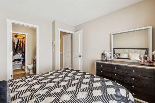 1202-125 Panatella Way Nw, Calgary, AB - Indoor Photo Showing Bedroom