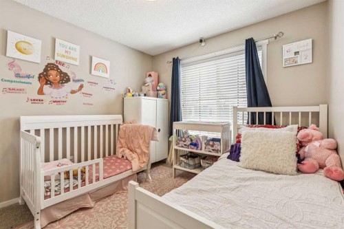 1202-125 Panatella Way Nw, Calgary, AB - Indoor Photo Showing Bedroom