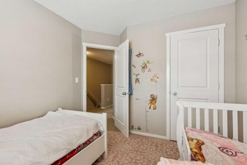 1202-125 Panatella Way Nw, Calgary, AB - Indoor Photo Showing Bedroom