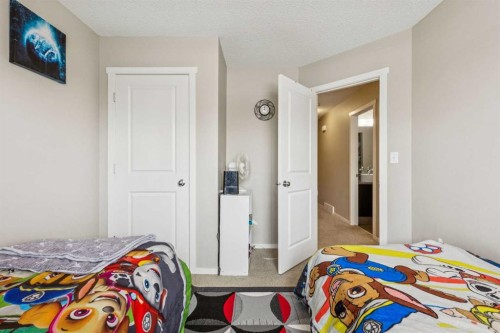 1202-125 Panatella Way Nw, Calgary, AB - Indoor Photo Showing Bedroom