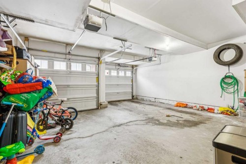 1202-125 Panatella Way Nw, Calgary, AB - Indoor Photo Showing Garage