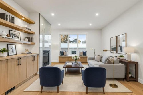 642 25 Avenue Nw, Calgary, AB - Indoor Photo Showing Living Room With Fireplace