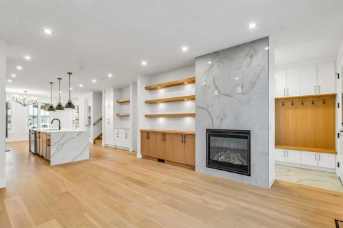 642 25 Avenue Nw, Calgary, AB - Indoor Photo Showing Living Room With Fireplace