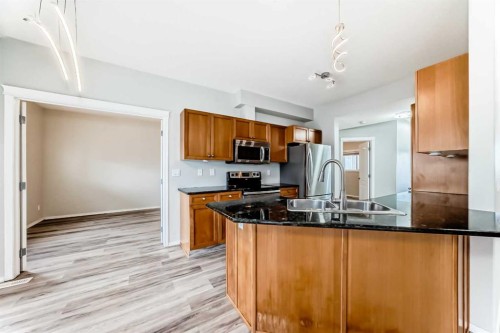 415 Sunrise Terrace Ne, High River, AB - Indoor Photo Showing Kitchen With Double Sink