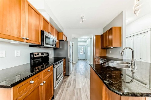 415 Sunrise Terrace Ne, High River, AB - Indoor Photo Showing Kitchen With Double Sink