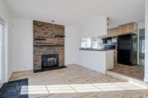 128 Bermuda Drive Nw, Calgary, AB - Indoor With Fireplace