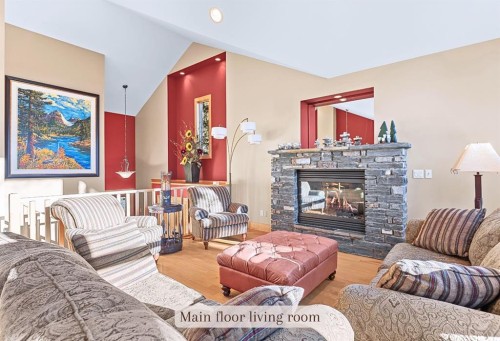 1-125 Stonecreek Road, Canmore, AB - Indoor Photo Showing Living Room With Fireplace