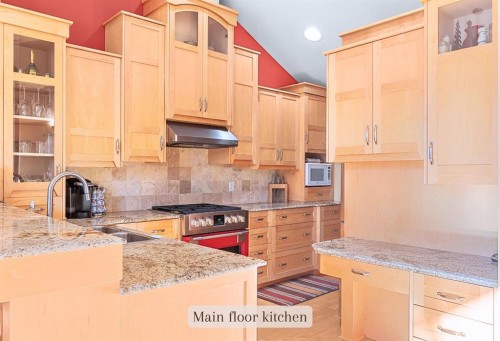 1-125 Stonecreek Road, Canmore, AB - Indoor Photo Showing Kitchen With Upgraded Kitchen