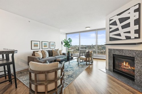 1103-801 2 Avenue Sw, Calgary, AB - Indoor Photo Showing Living Room With Fireplace