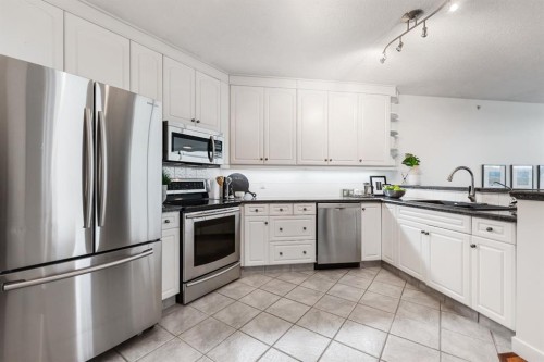 1103-801 2 Avenue Sw, Calgary, AB - Indoor Photo Showing Kitchen With Stainless Steel Kitchen